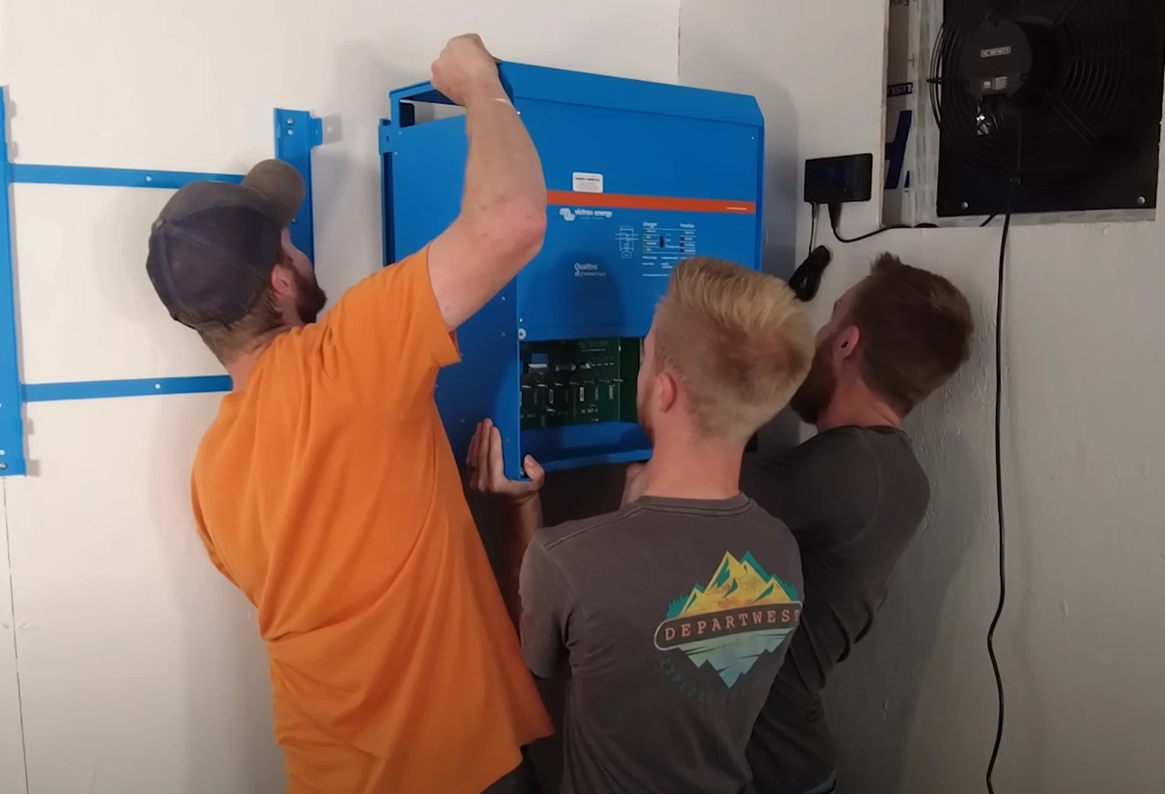 High quality photo of 3 Current Connected members installing Victron featured in the Current Connected weekly newsletter. Photographed by Current Connected.