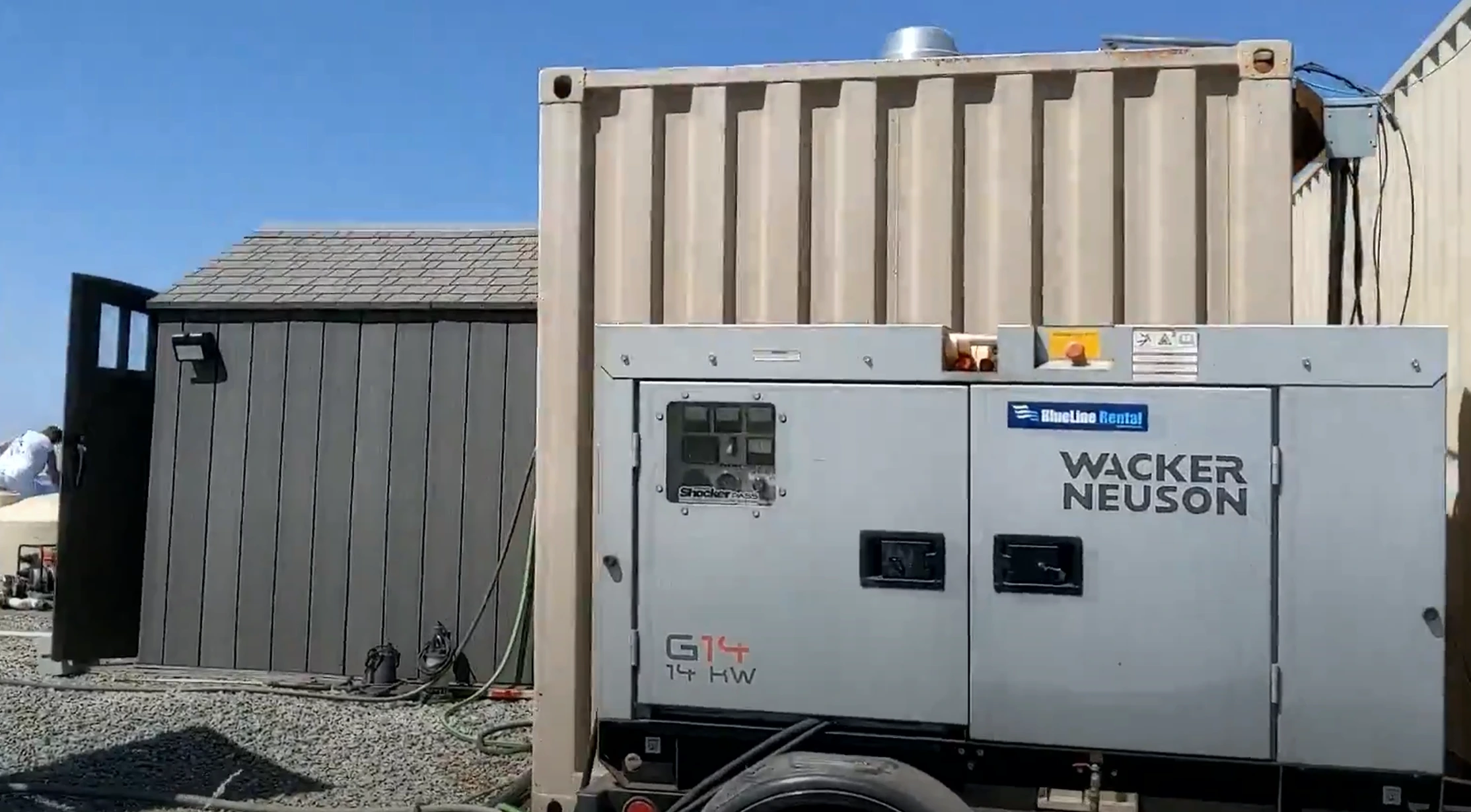 High quality photo of off grid property with generator, house, and storage container featured in the Current Connected weekly newsletter. Photographed by Current Connected.