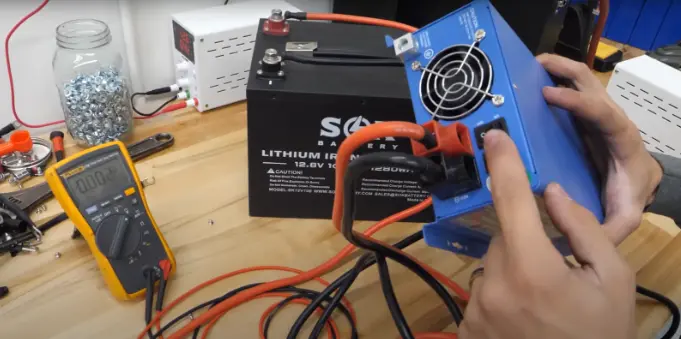High quality image of a demo of Dexter charging a dead battery with an inverter-charger