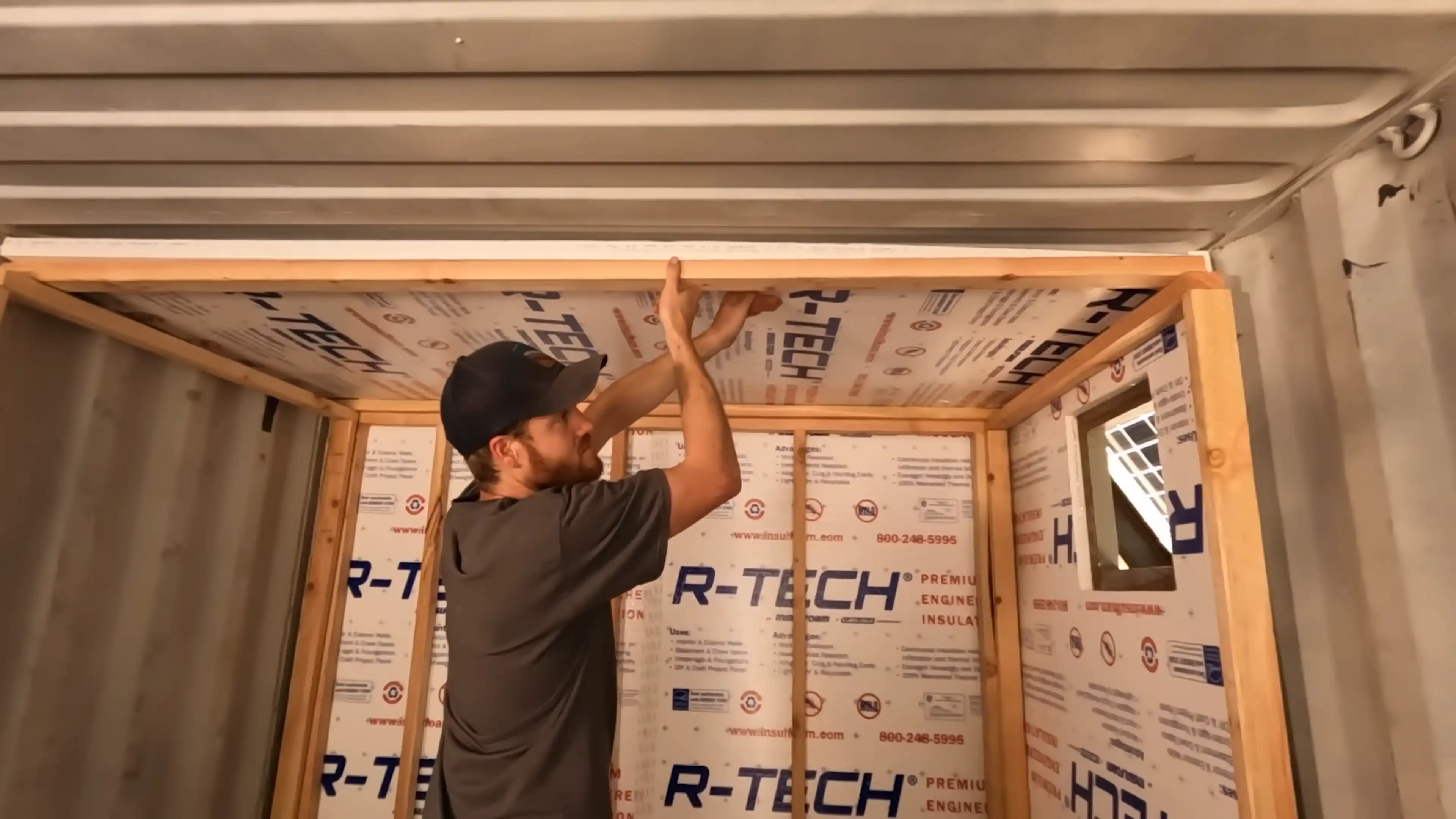 Photo of Riley framing the battery storage area. Photographed by Current Connected.